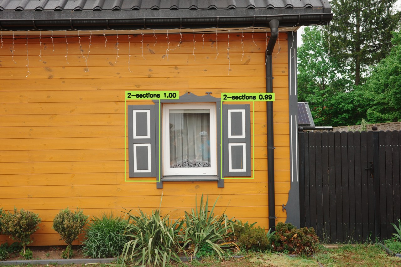 Two-section shutters on a yellow timber house, detected as separate panels