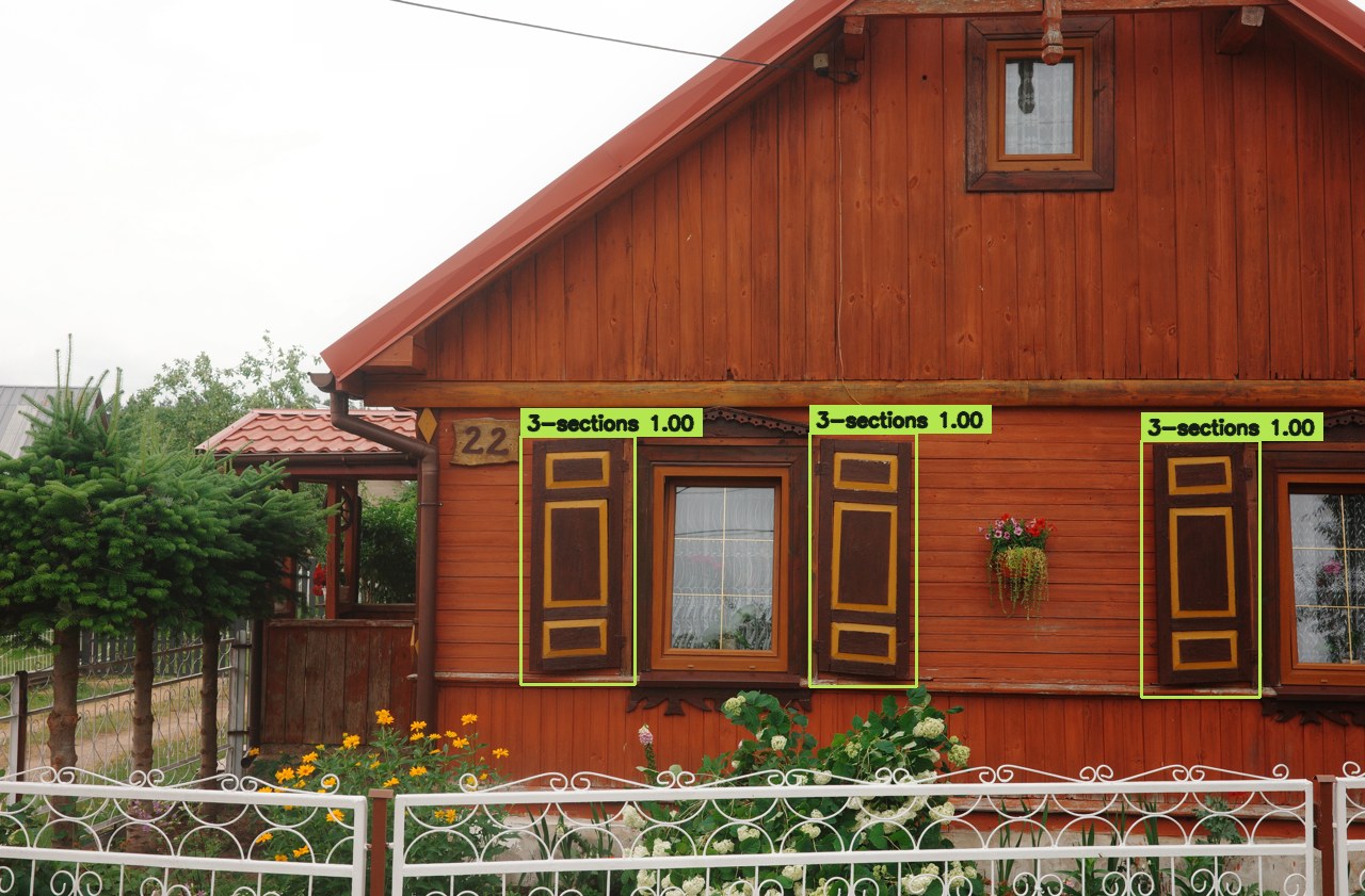 Three-section shutters on a red timber facade with predicted panel boxes